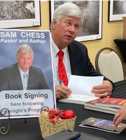 Sam Chess speaking at a live event